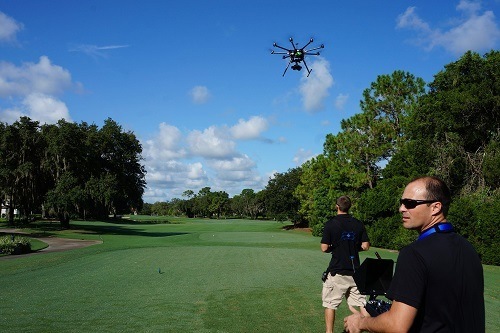 Man Flying Drone on Golf Terrain