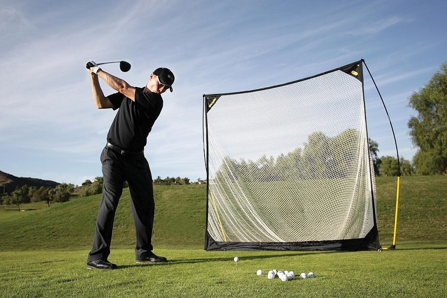 Man Playing Golf with Golf Net