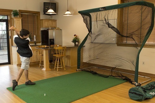Man Playing Golf with Golf Net