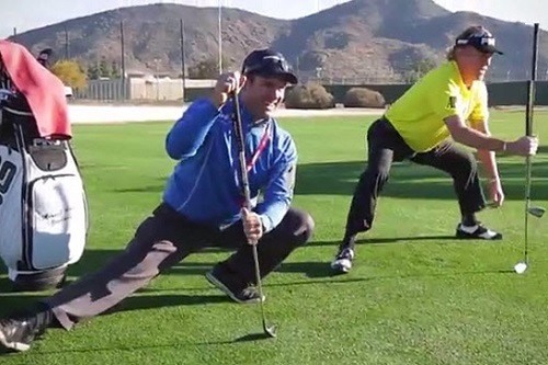 Two Men Stretching Before Playing Golf
